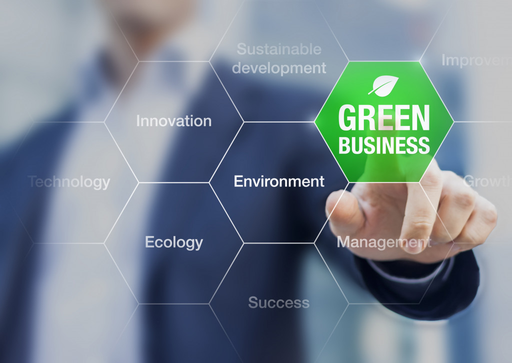 businessman pressing green business